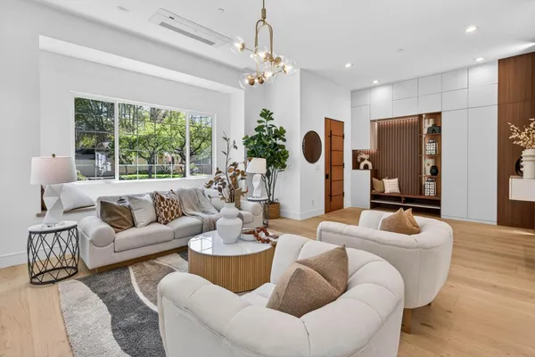a living room with furniture and a large window