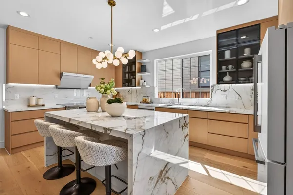 a kitchen with a table and chairs in it
