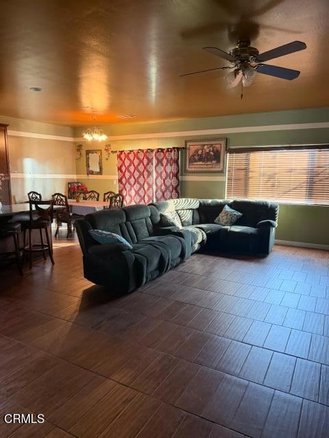 9116 Kellyann Street Bakersfield, CA 93313 - Photo 16 of 37 a living room with furniture and a window