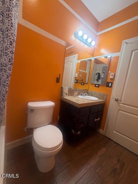 9116 Kellyann Street Bakersfield, CA 93313 - Photo 22 of 37 a bathroom with a toilet sink and mirror