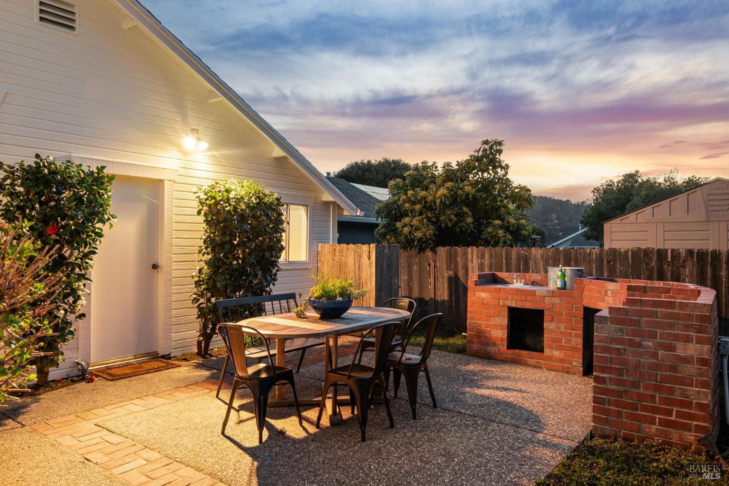 700 B Street Point Reyes Station, CA 94956 - Photo 21 of 26 a backyard of a house with table and chairs