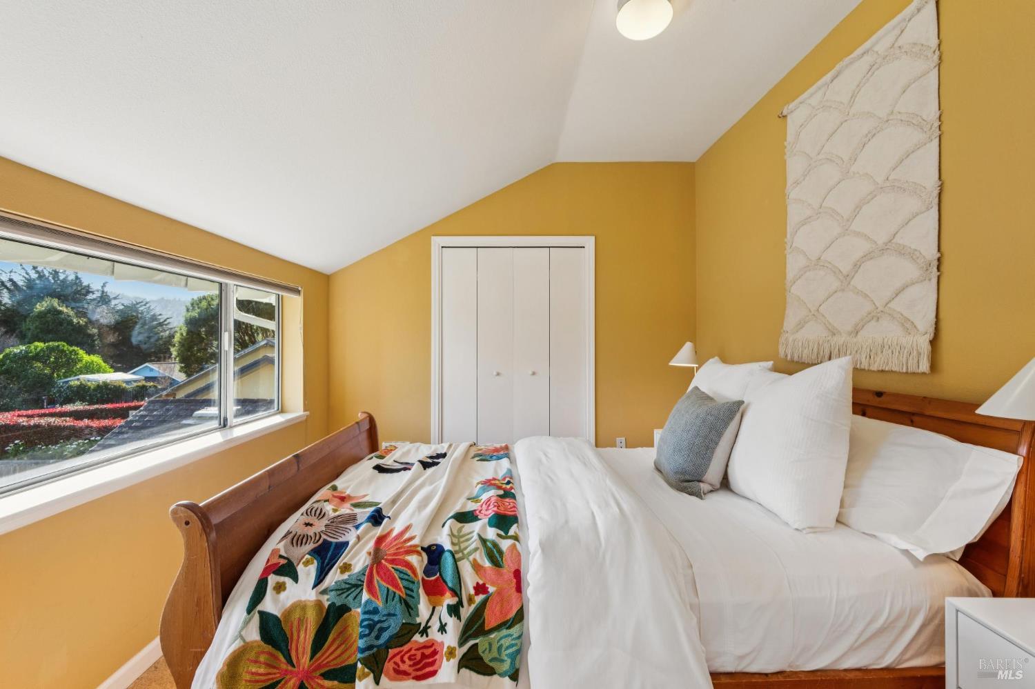 700 B Street Point Reyes Station, CA 94956 - Photo 10 of 26 a bedroom with a bed and a large window with outer view