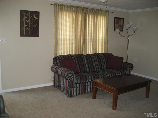 7500 Rock Service Station Road Raleigh, NC 27603 - Photo 5 of 21 Another view of the living room.