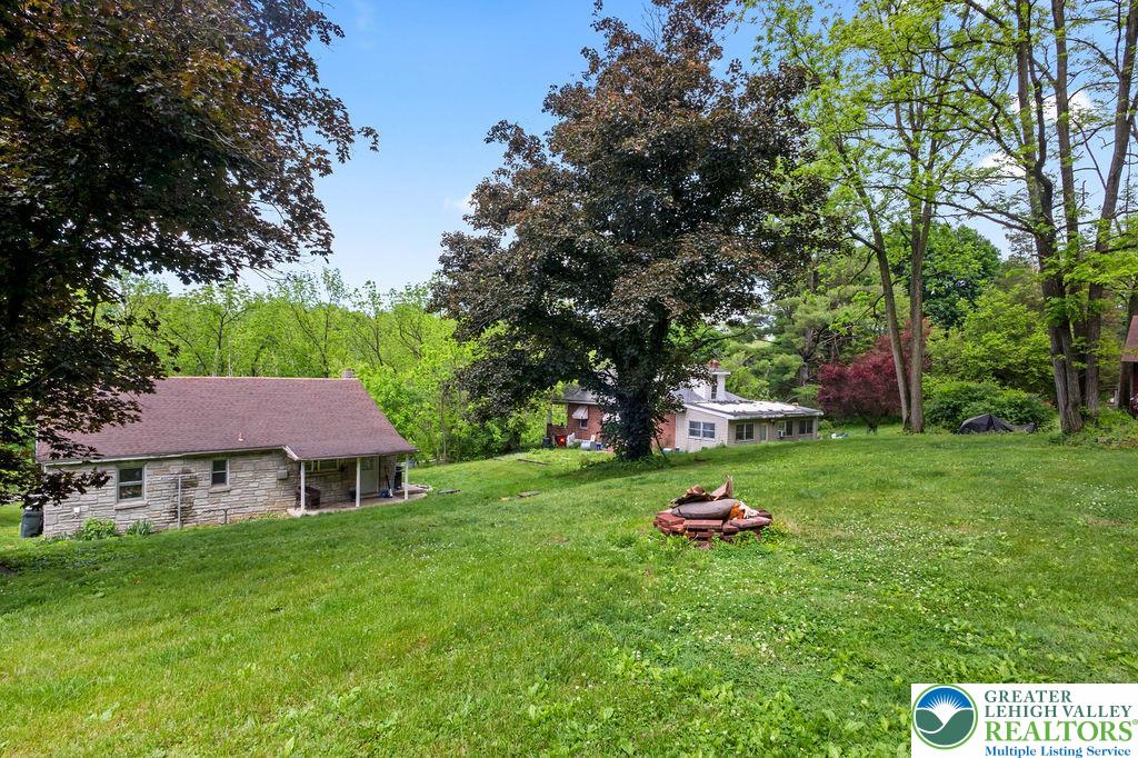 1644 Moselem Spring Road Hamburg, PA 19526 - Photo 22 of 24 a backyard of a house with table and chairs