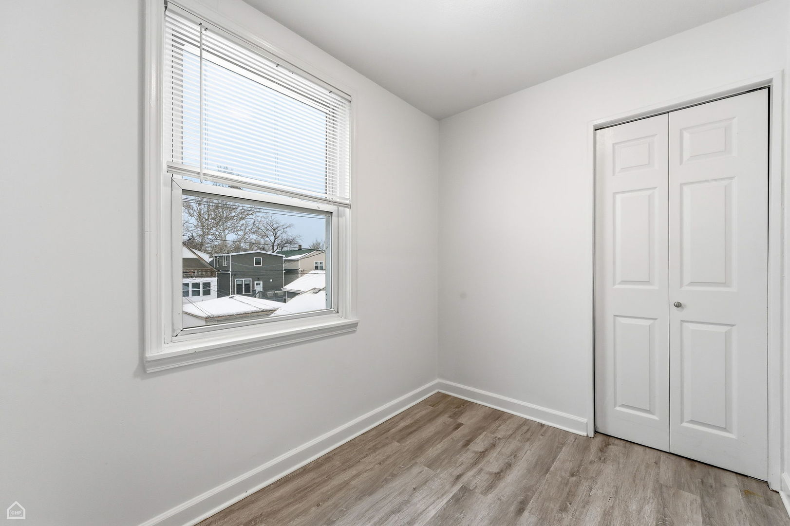 5250 West Grace Street, Unit 2 Chicago, IL 60641 - Photo 12 of 12 an empty room with a window