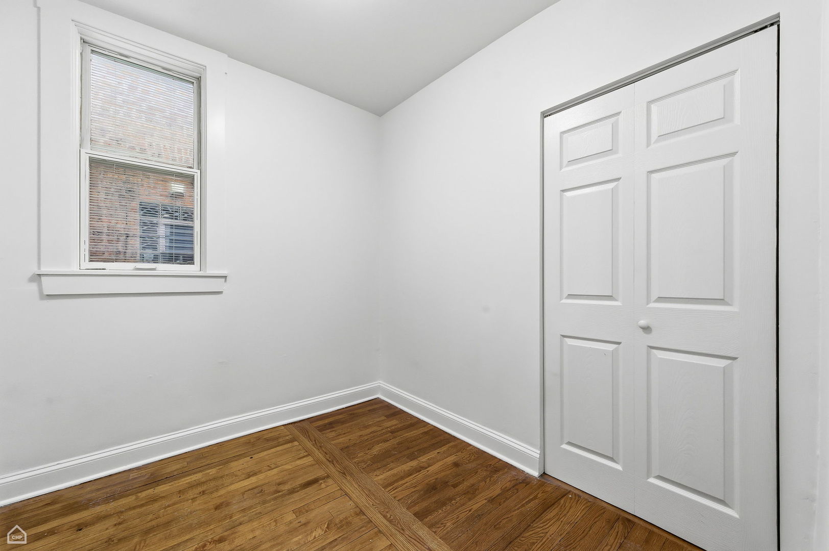 5250 West Grace Street, Unit 2 Chicago, IL 60641 - Photo 10 of 12 wooden floor in an empty room