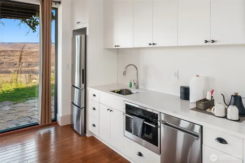 a bathroom with a sink mirror toilet and bathtub