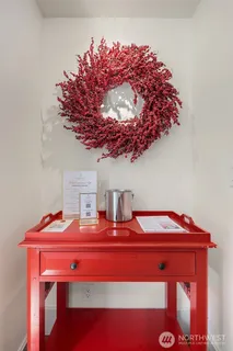 a bedroom with a bed and a mirror