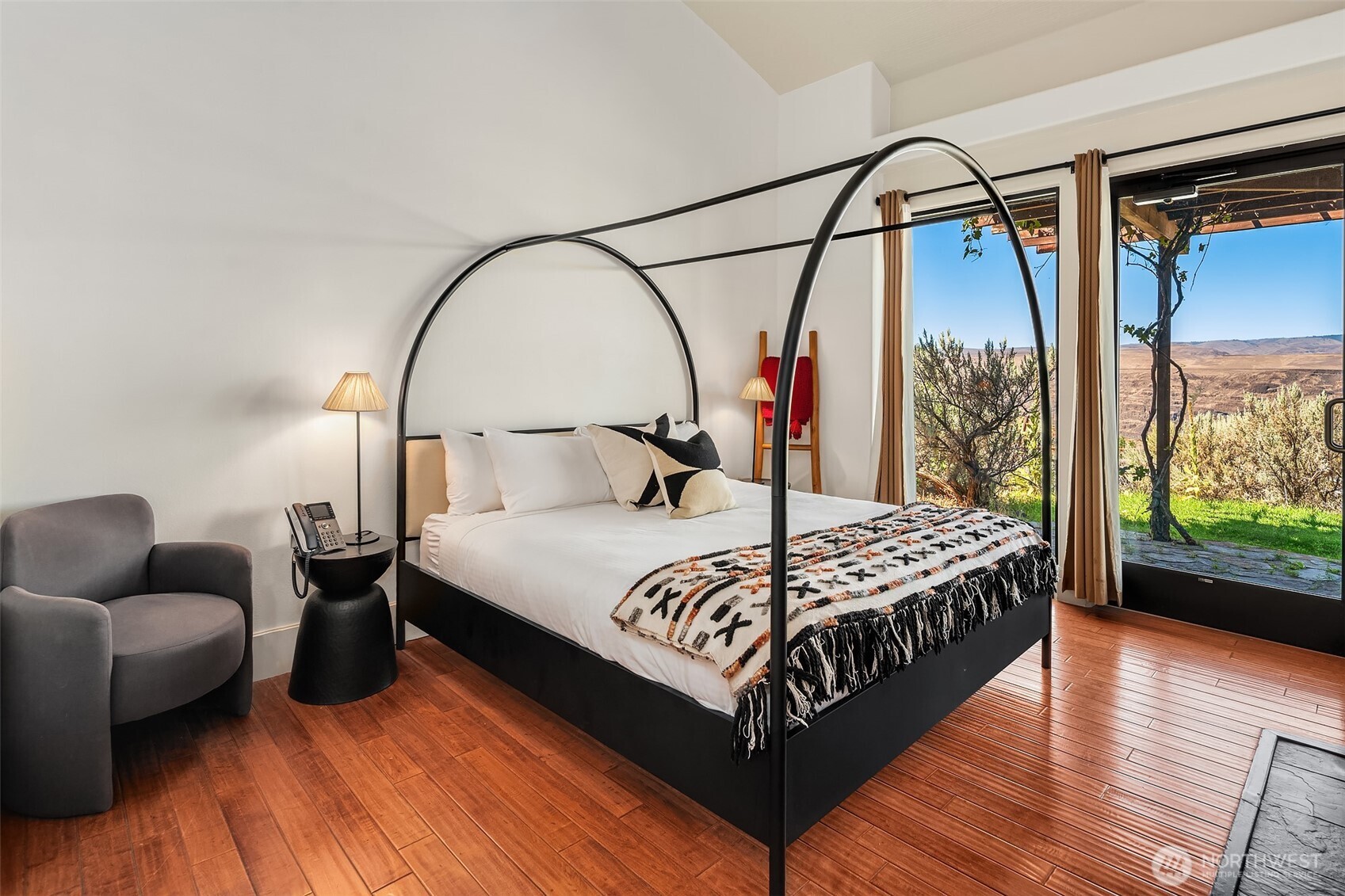 344 Silica Road Northwest, Unit 1 Quincy, WA 98848 - Photo 14 of 30 a bedroom with a bed and a mirror