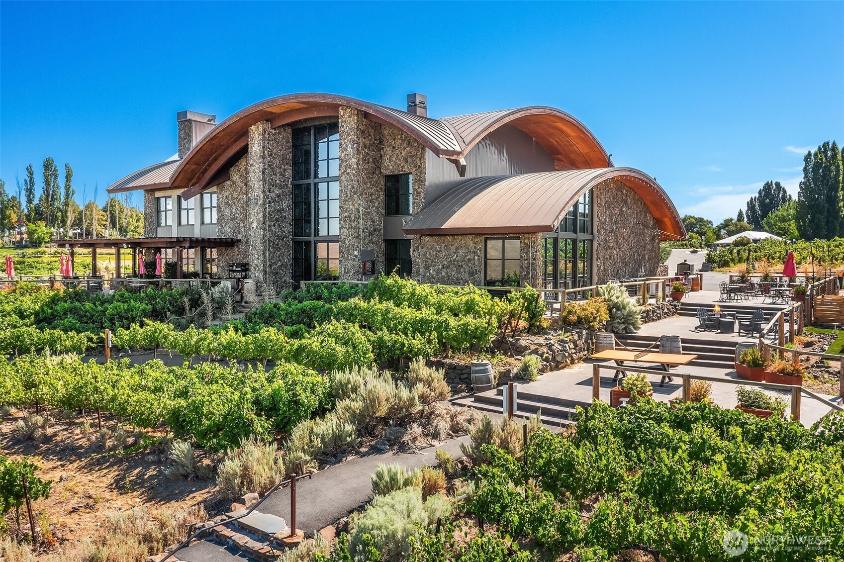 344 Silica Road Northwest, Unit 1 Quincy, WA 98848 - Photo 17 of 30 a front view of a house with a yard and fountain