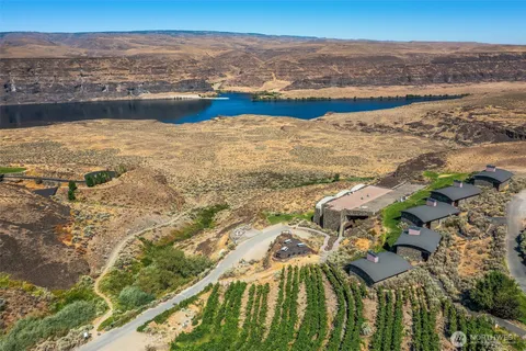 an aerial view of a house with a yard