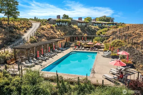 a view of a chairs and table in the patio