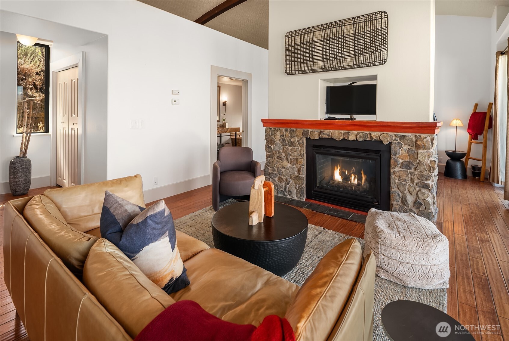 344 Silica Road Northwest, Unit 1 Quincy, WA 98848 - Photo 8 of 30 a living room with furniture a fireplace and a flat screen tv