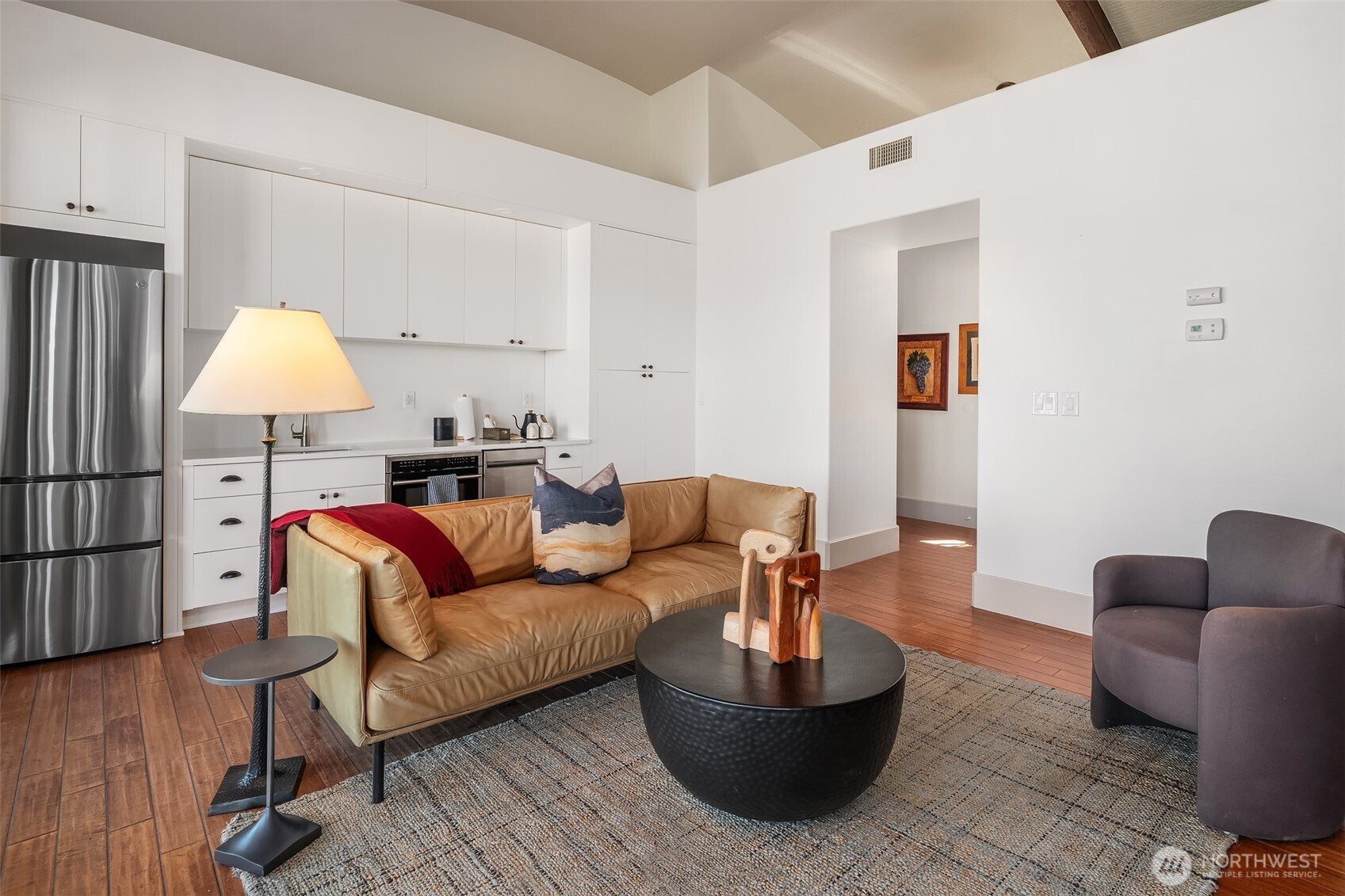 344 Silica Road Northwest, Unit 1 Quincy, WA 98848 - Photo 10 of 30 a living room with furniture and a lamp