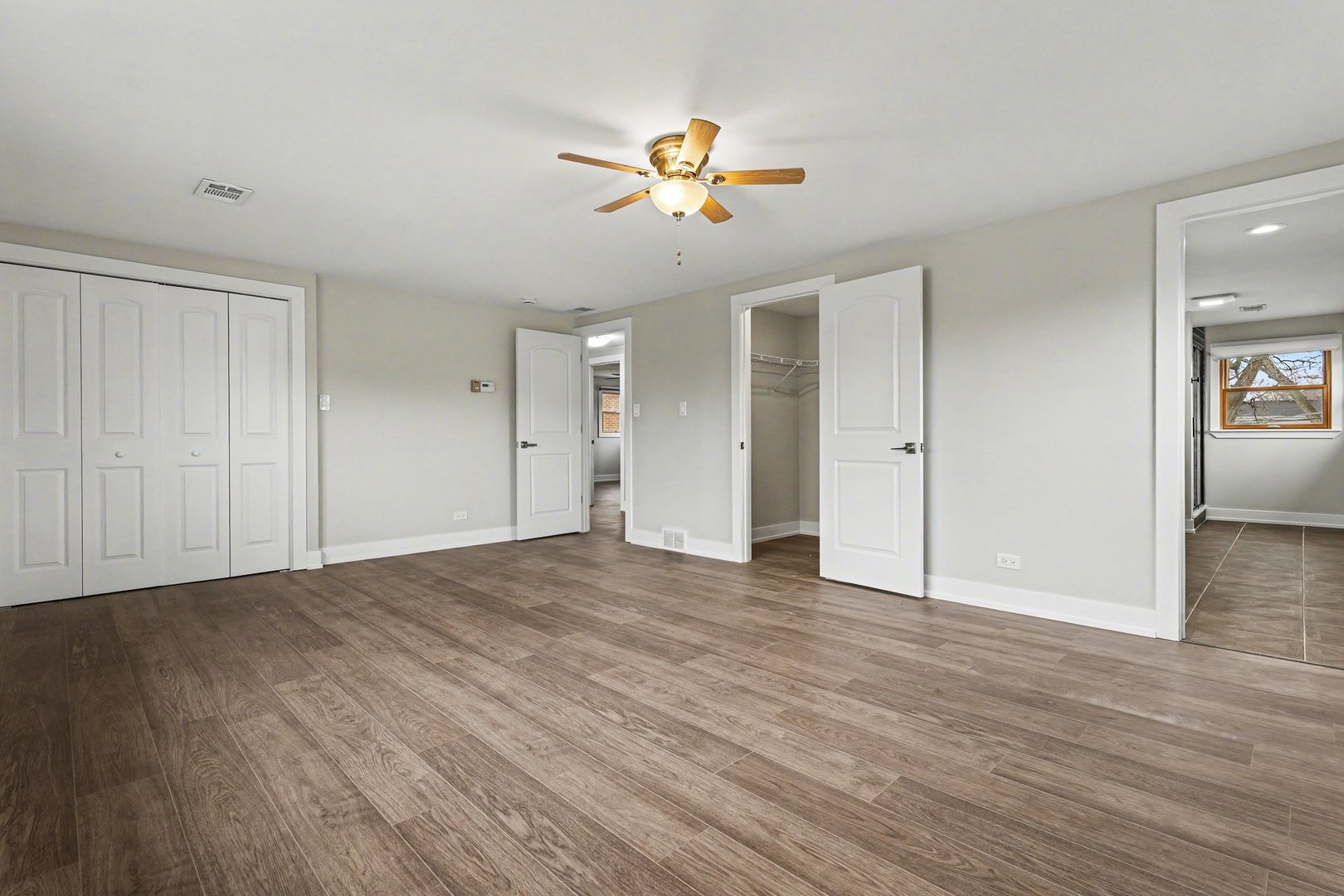 538 North Broadway Avenue Park Ridge, IL 60068 - Photo 17 of 34 a view of an empty room with wooden floor and a ceiling fan