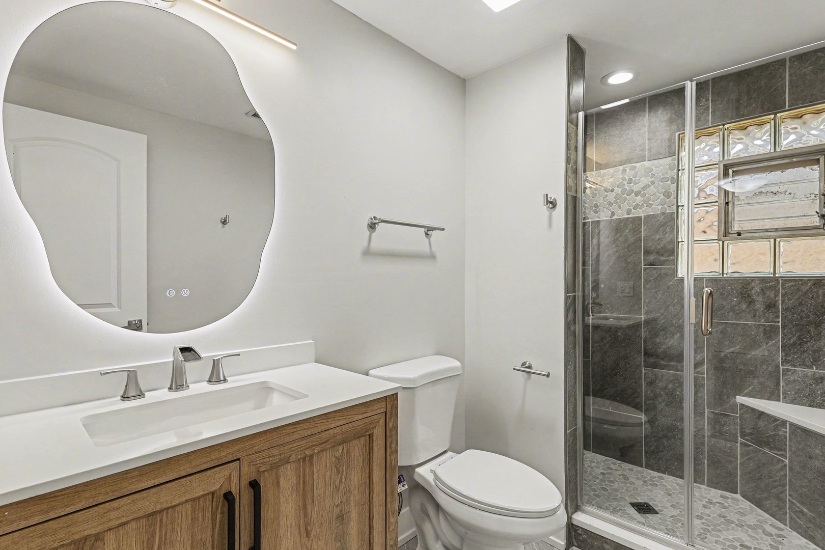 538 North Broadway Avenue Park Ridge, IL 60068 - Photo 24 of 34 a bathroom with a granite countertop sink a toilet and shower
