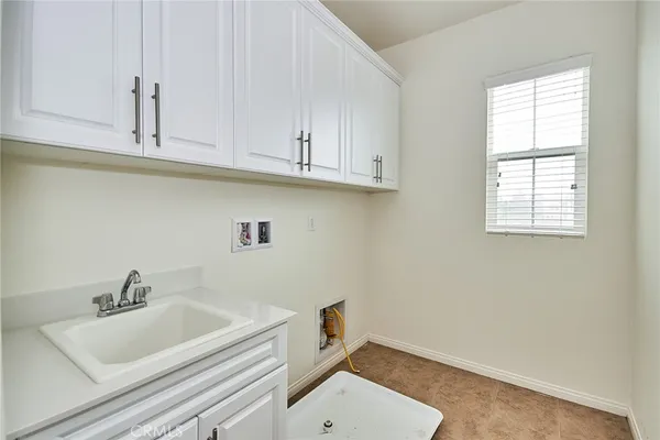 a bathroom with a sink and cabinets
