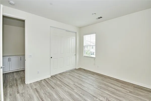 an empty room with wooden floor