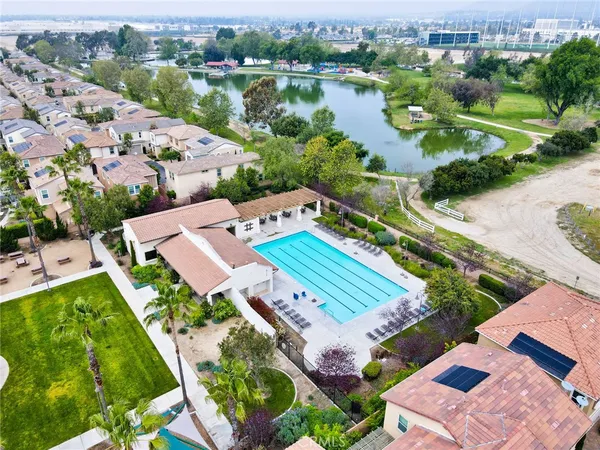 an aerial view of a house with a lake view