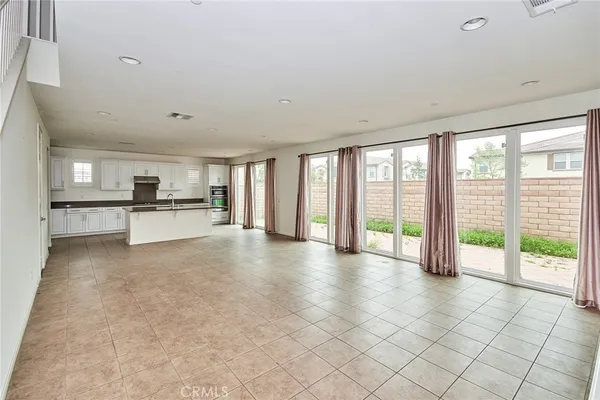 a view of a kitchen with a sink and cabinets