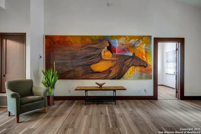 a view of a room with furniture wooden floor and window