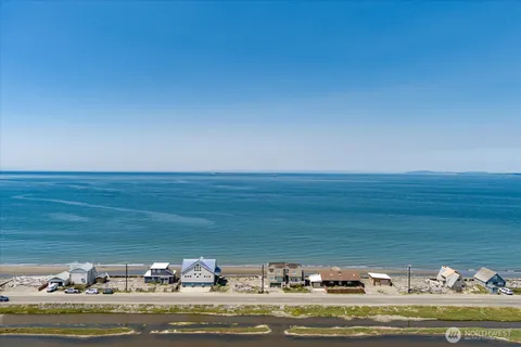 a view of swimming pool with a table and chairs