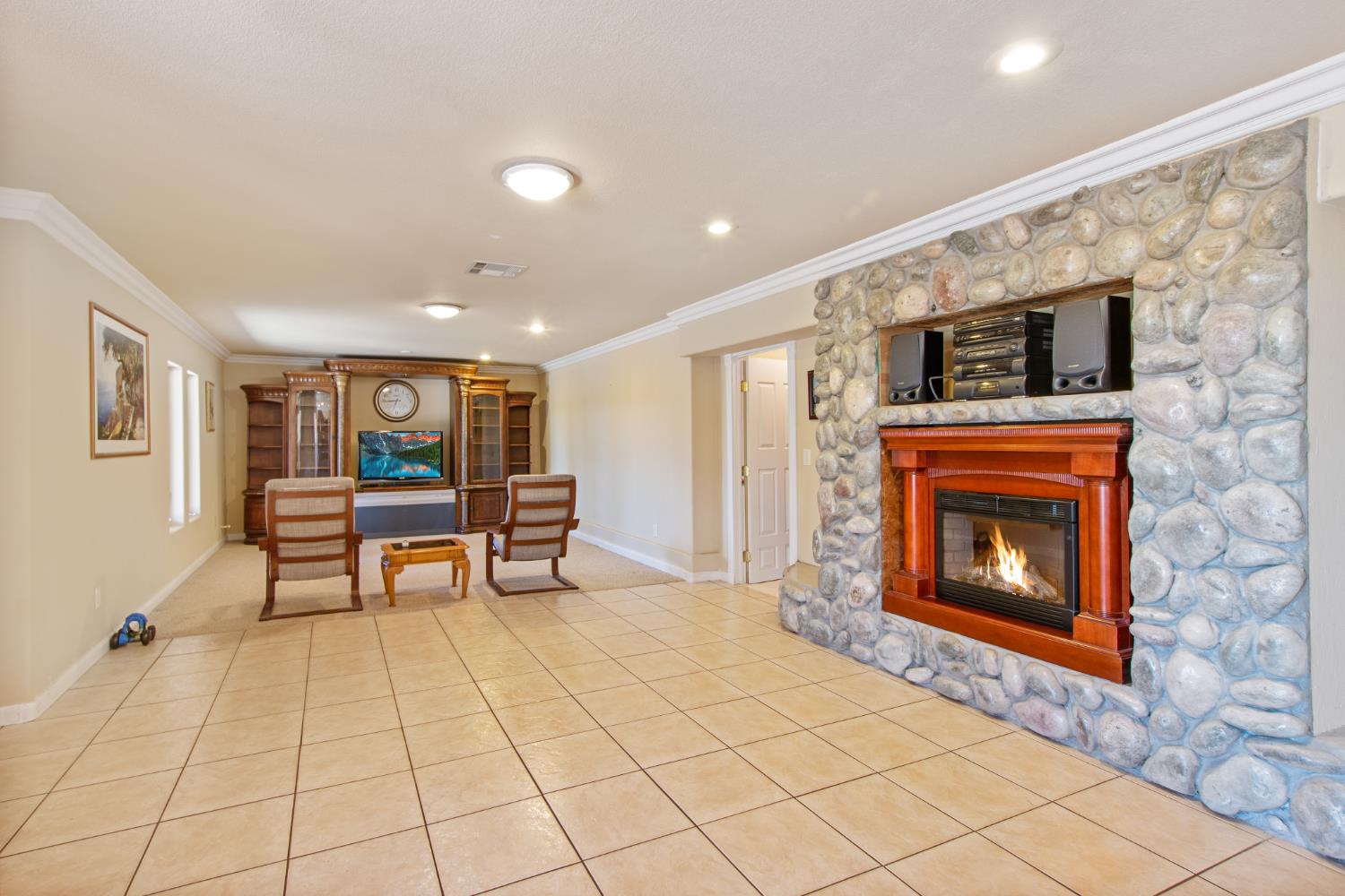 717 Swanson Lane Colfax, CA 95713 - Photo 13 of 44 a living room with furniture a fireplace and a flat screen tv