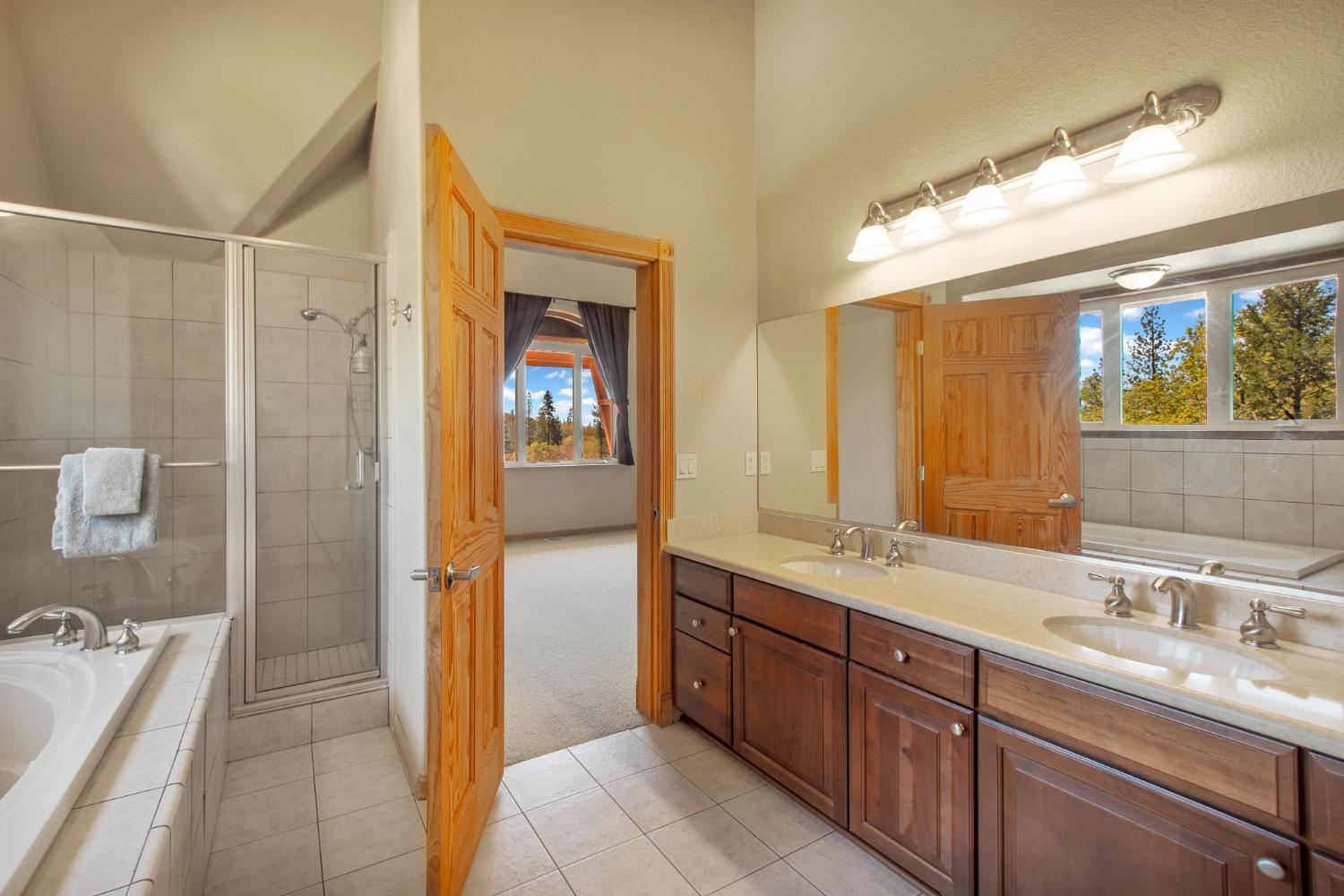 717 Swanson Lane Colfax, CA 95713 - Photo 21 of 44 a bathroom with a granite countertop sink mirror and double