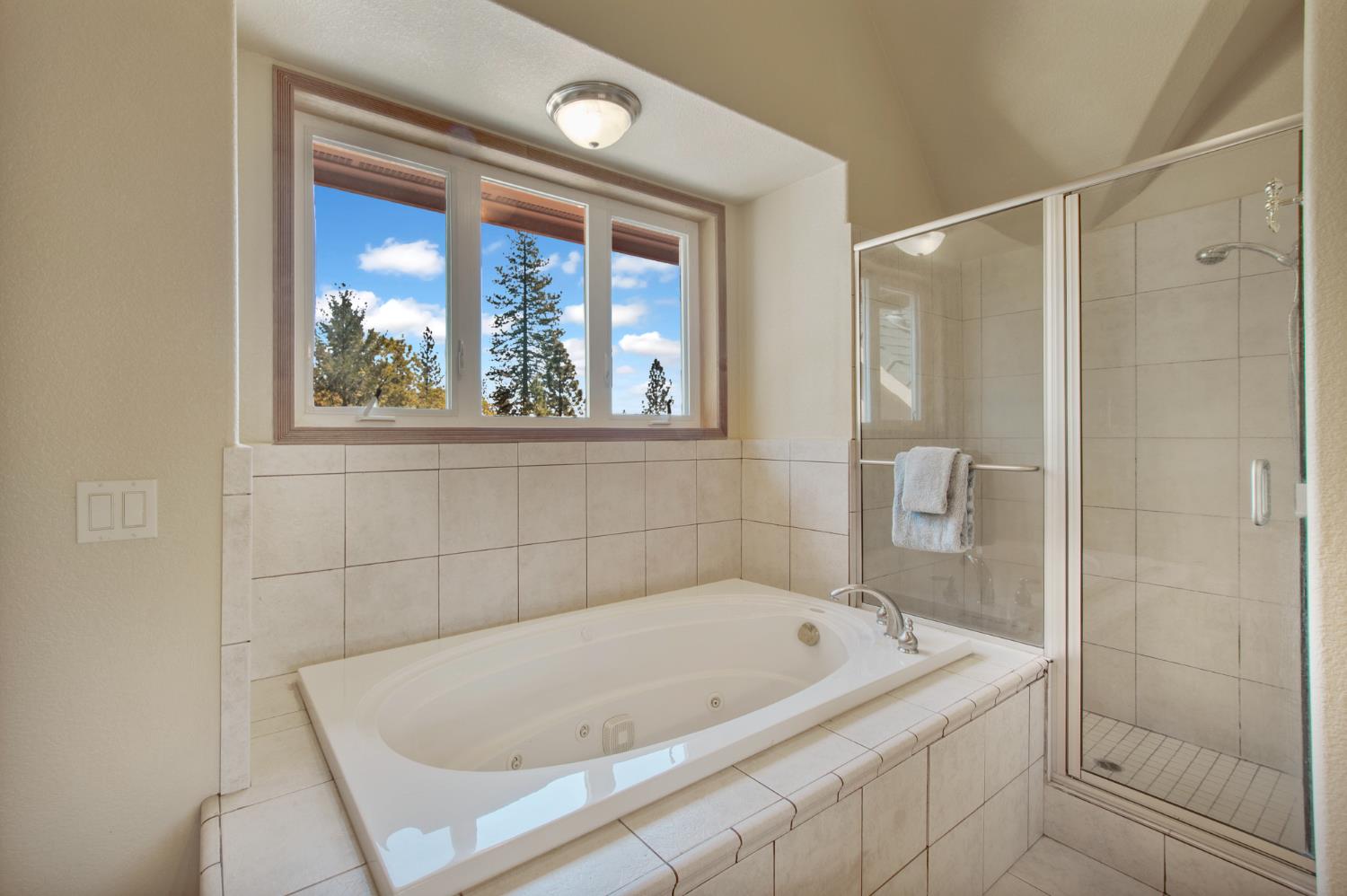717 Swanson Lane Colfax, CA 95713 - Photo 22 of 44 a bathroom with a tub and shower