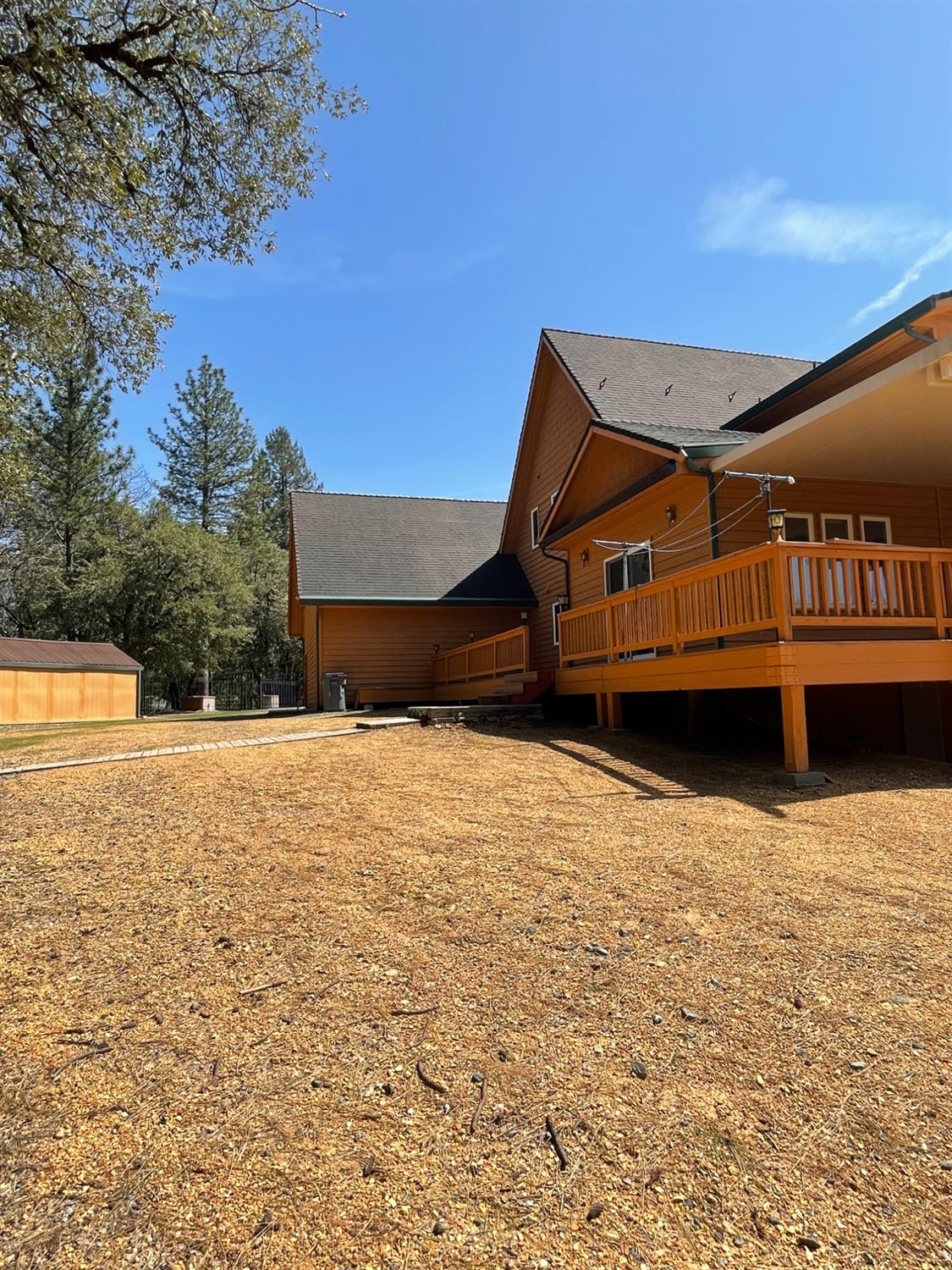 717 Swanson Lane Colfax, CA 95713 - Photo 32 of 44 a backyard of a house with wooden fence