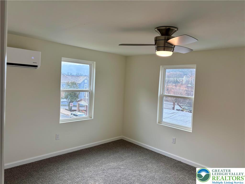 253 Main Street Parryville, PA 18071 - Photo 17 of 31 an empty room with windows