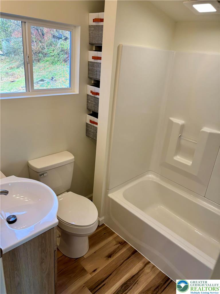 253 Main Street Parryville, PA 18071 - Photo 20 of 31 a white toilet sitting next to a bath tub