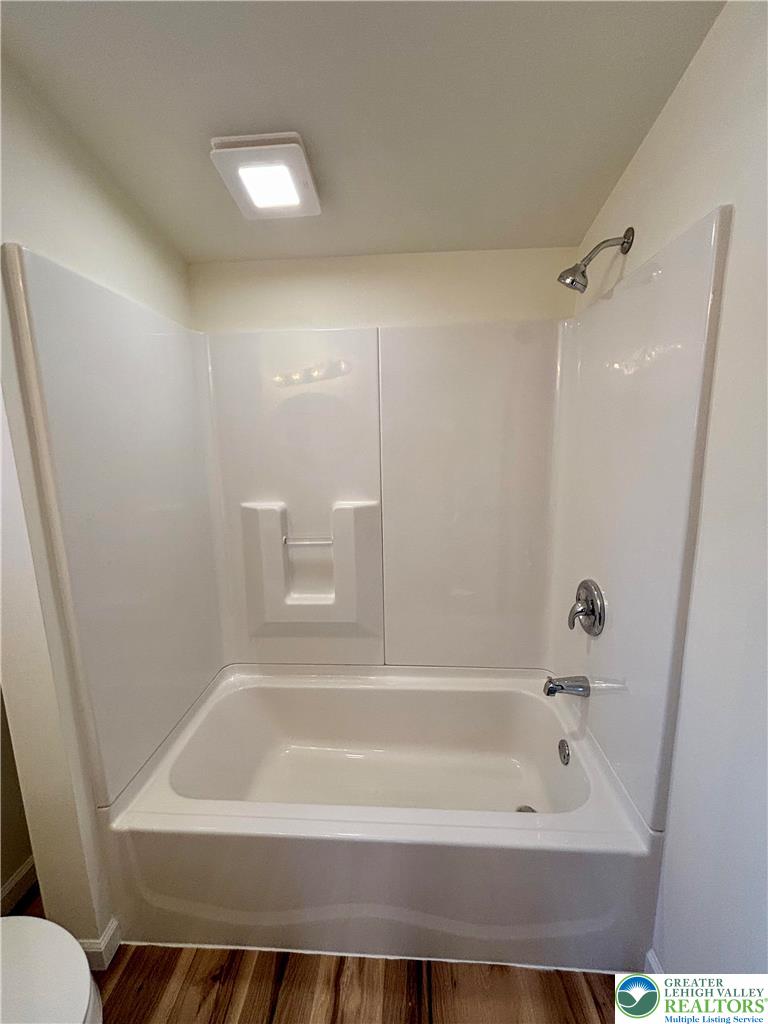 253 Main Street Parryville, PA 18071 - Photo 21 of 31 a bathroom with a bathtub and a toilet