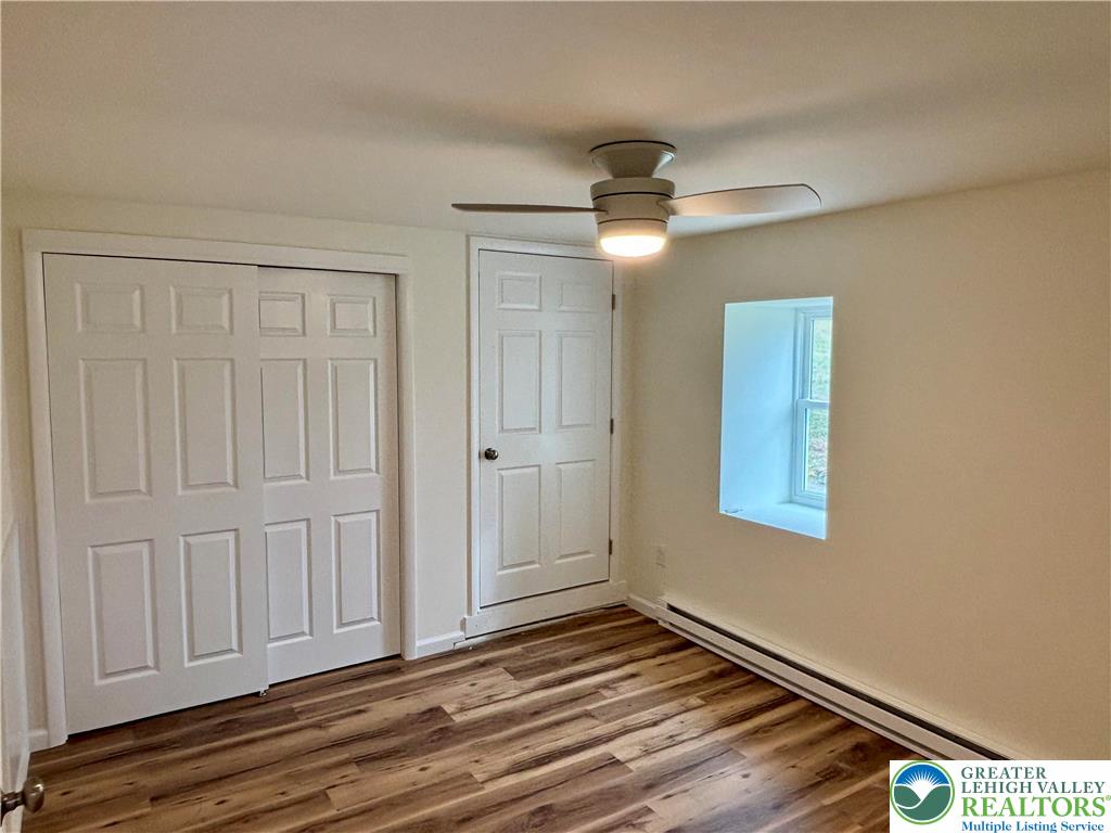 253 Main Street Parryville, PA 18071 - Photo 25 of 31 an empty room with wooden floor closet and windows