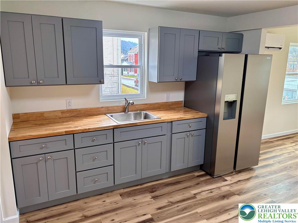 253 Main Street Parryville, PA 18071 - Photo 4 of 31 a kitchen with sink cabinets and refrigerator