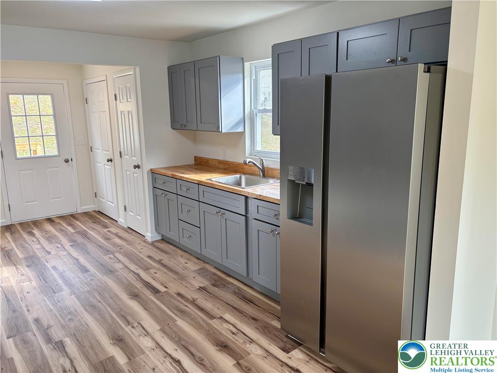 253 Main Street Parryville, PA 18071 - Photo 6 of 31 a kitchen with a refrigerator and a sink