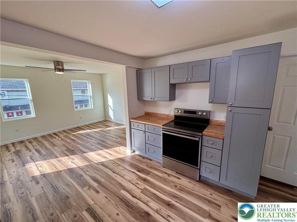 253 Main Street Parryville, PA 18071 - Photo 8 of 31 a kitchen with granite countertop a stove and a refrigerator