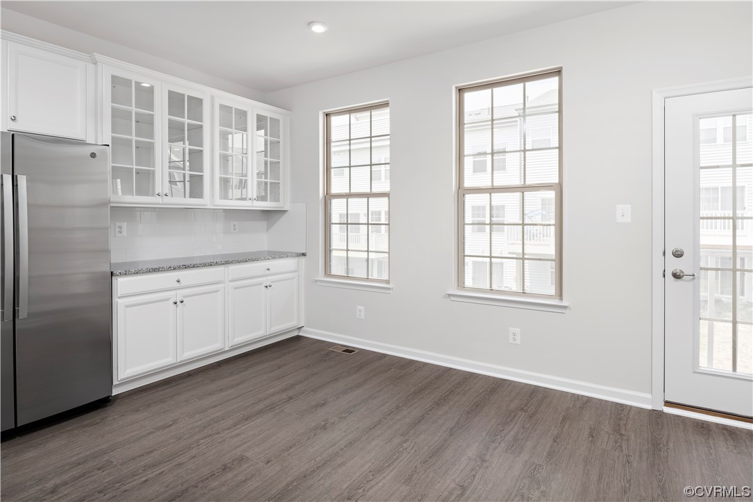 1207 Lazy River Road, Unit 17C Midlothian, VA 23114 - Photo 4 of 7 an empty room with wooden floor and windows