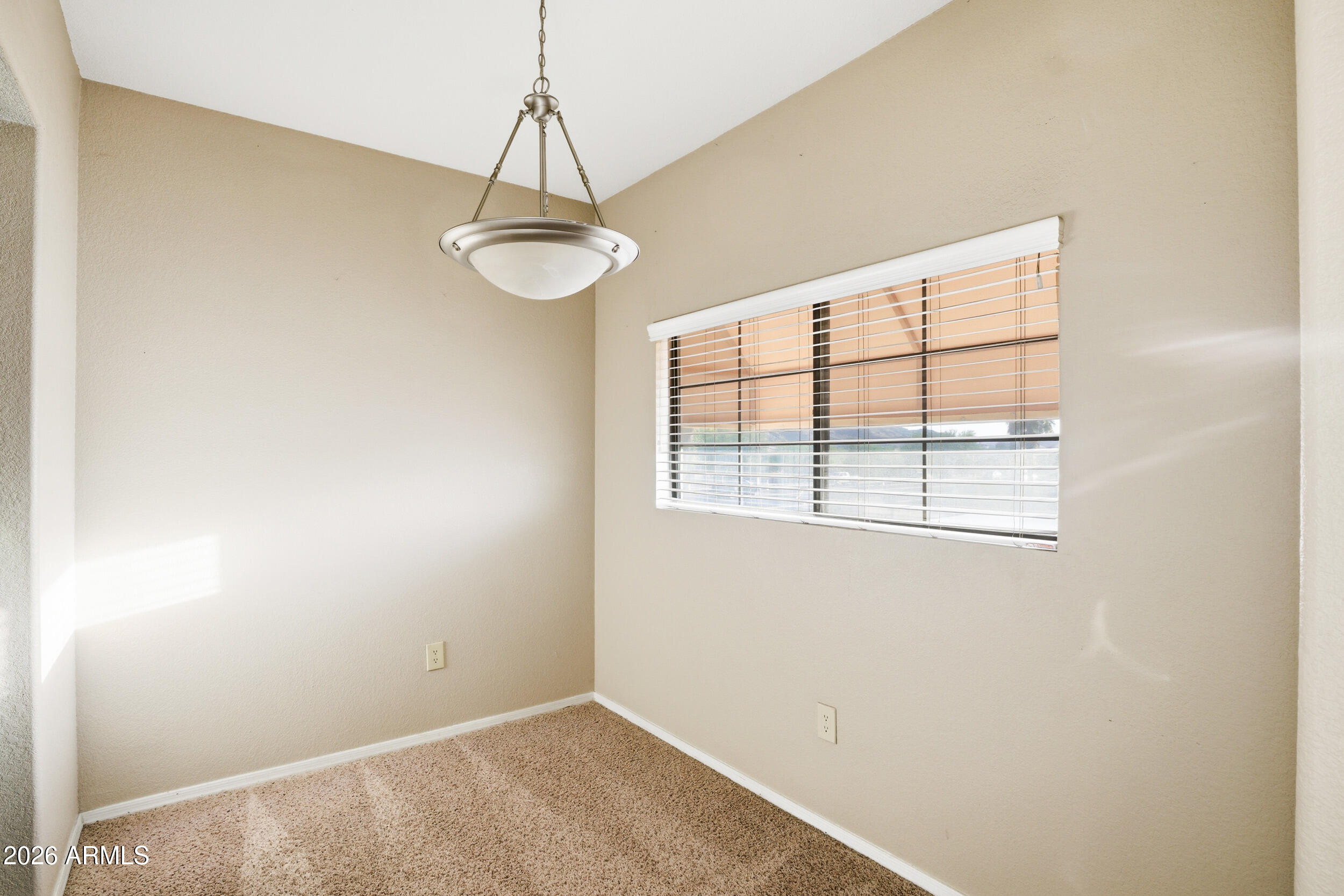 3434 East Baseline Road, Unit 264 Phoenix, AZ 85042 - Photo 8 of 12 a view of an empty room with a window