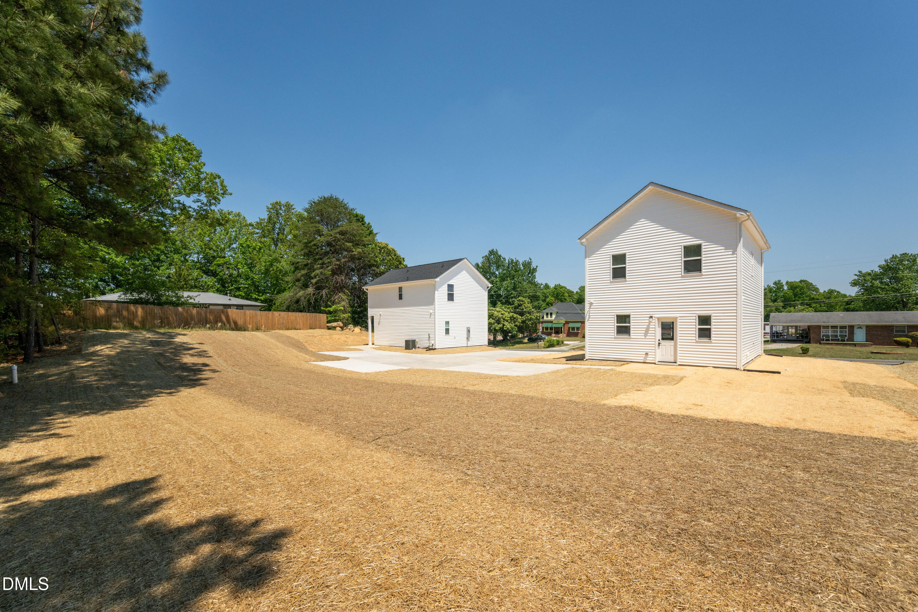 1196 Hurdle Mills Road Roxboro, NC 27573 - Photo 45 of 50 a view of white house with a swimming pool and sitting area