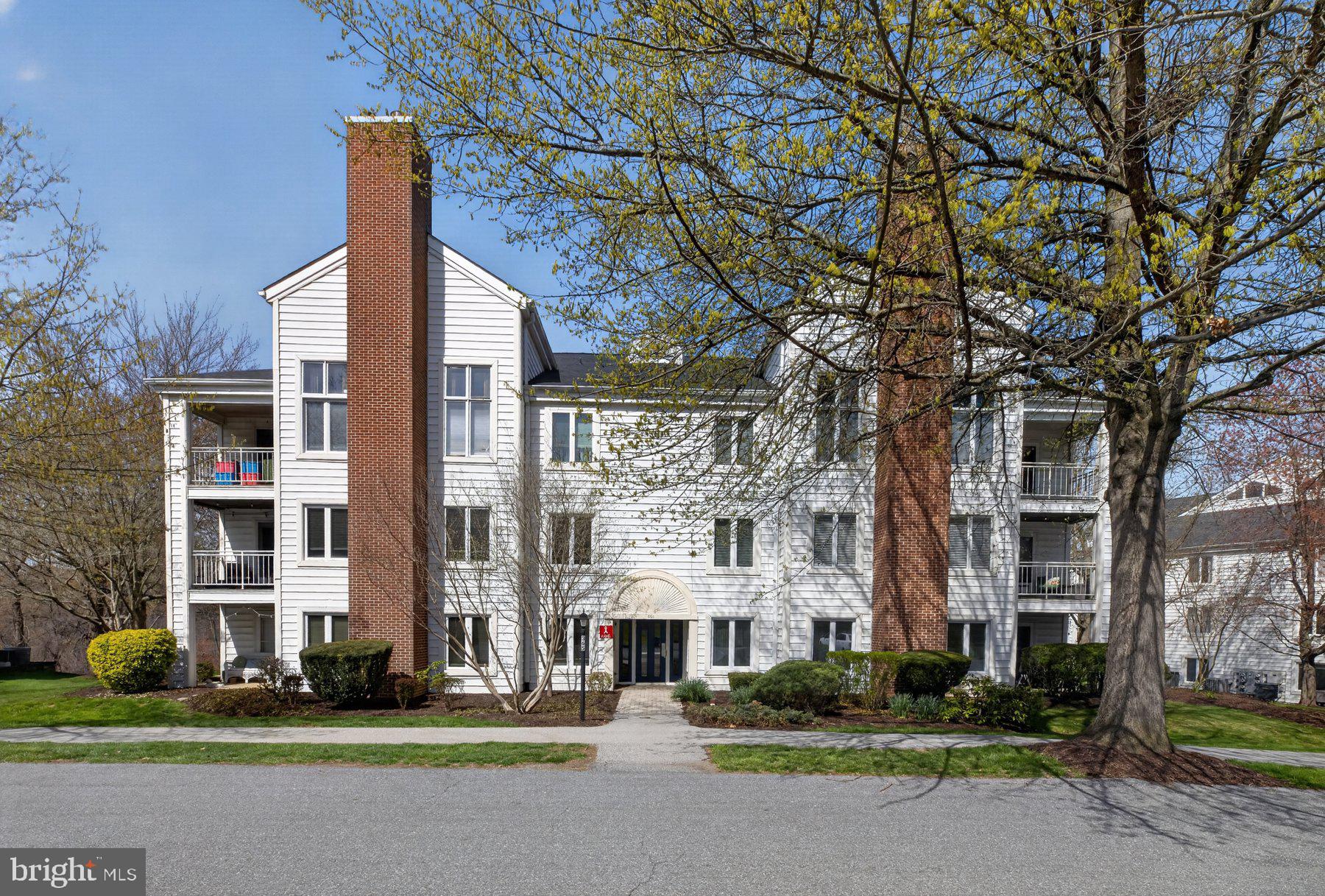 365 Pleasanton Road, Unit A13 Westminster, MD 21157 - Photo 1 of 25 a city street lined with buildings and trees