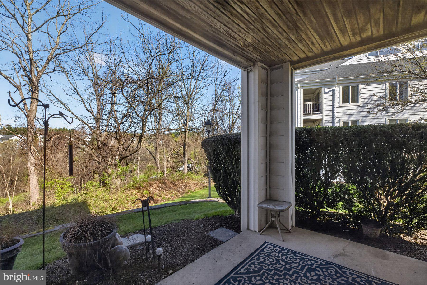 365 Pleasanton Road, Unit A13 Westminster, MD 21157 - Photo 21 of 25 a view of a porch with wooden fence and floor