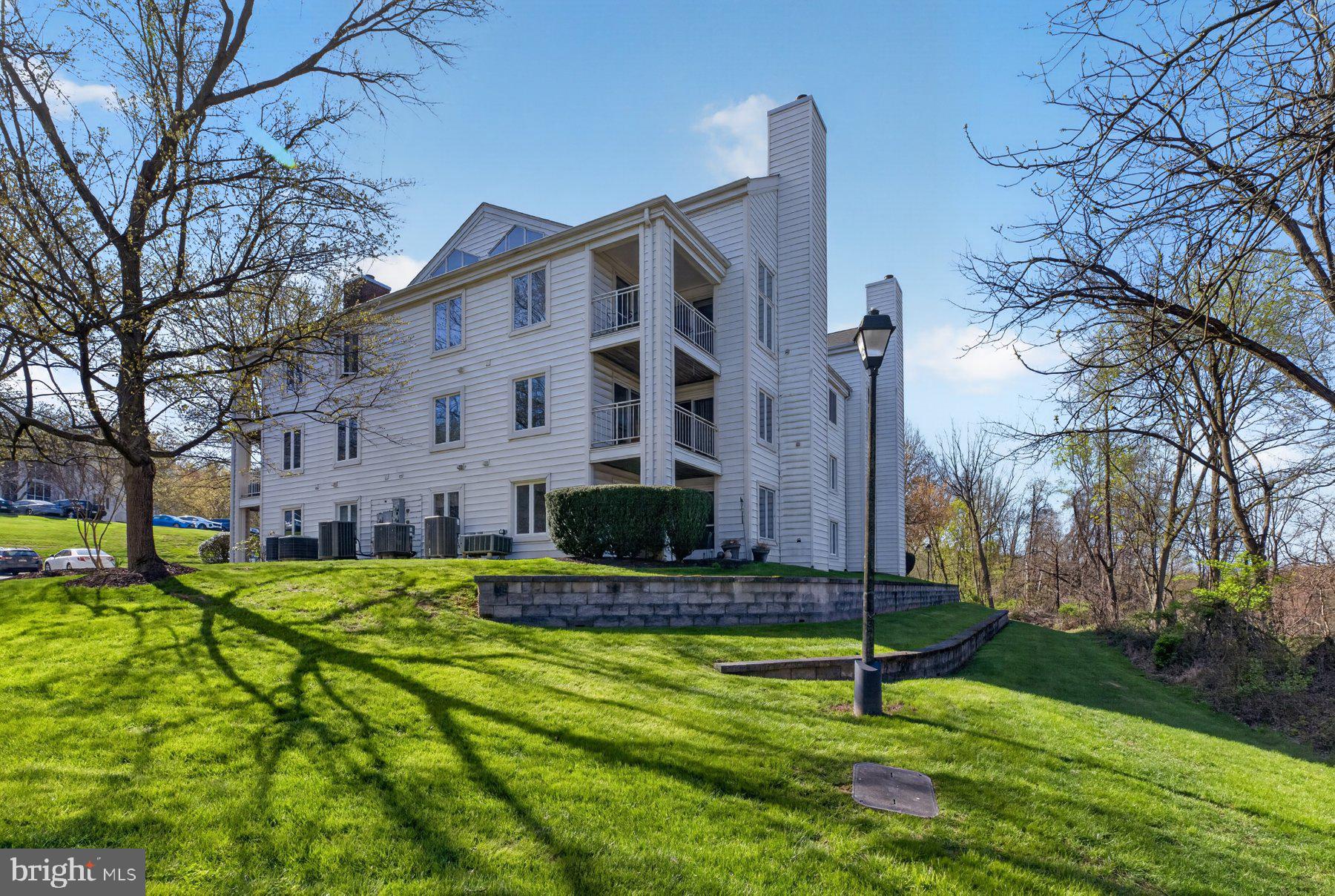 365 Pleasanton Road, Unit A13 Westminster, MD 21157 - Photo 23 of 25 a view of a house with a yard