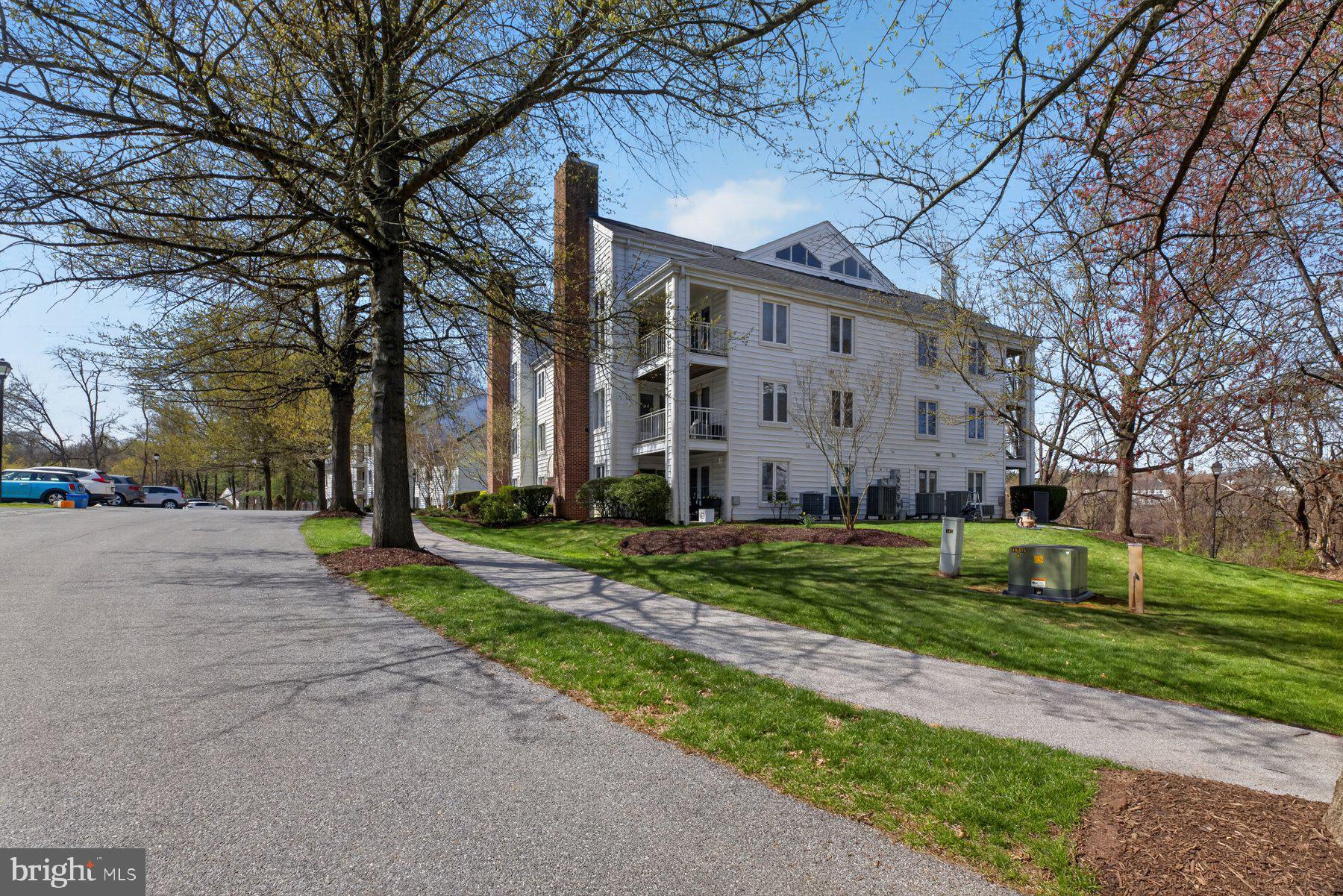 365 Pleasanton Road, Unit A13 Westminster, MD 21157 - Photo 24 of 25 a view of a building with a yard