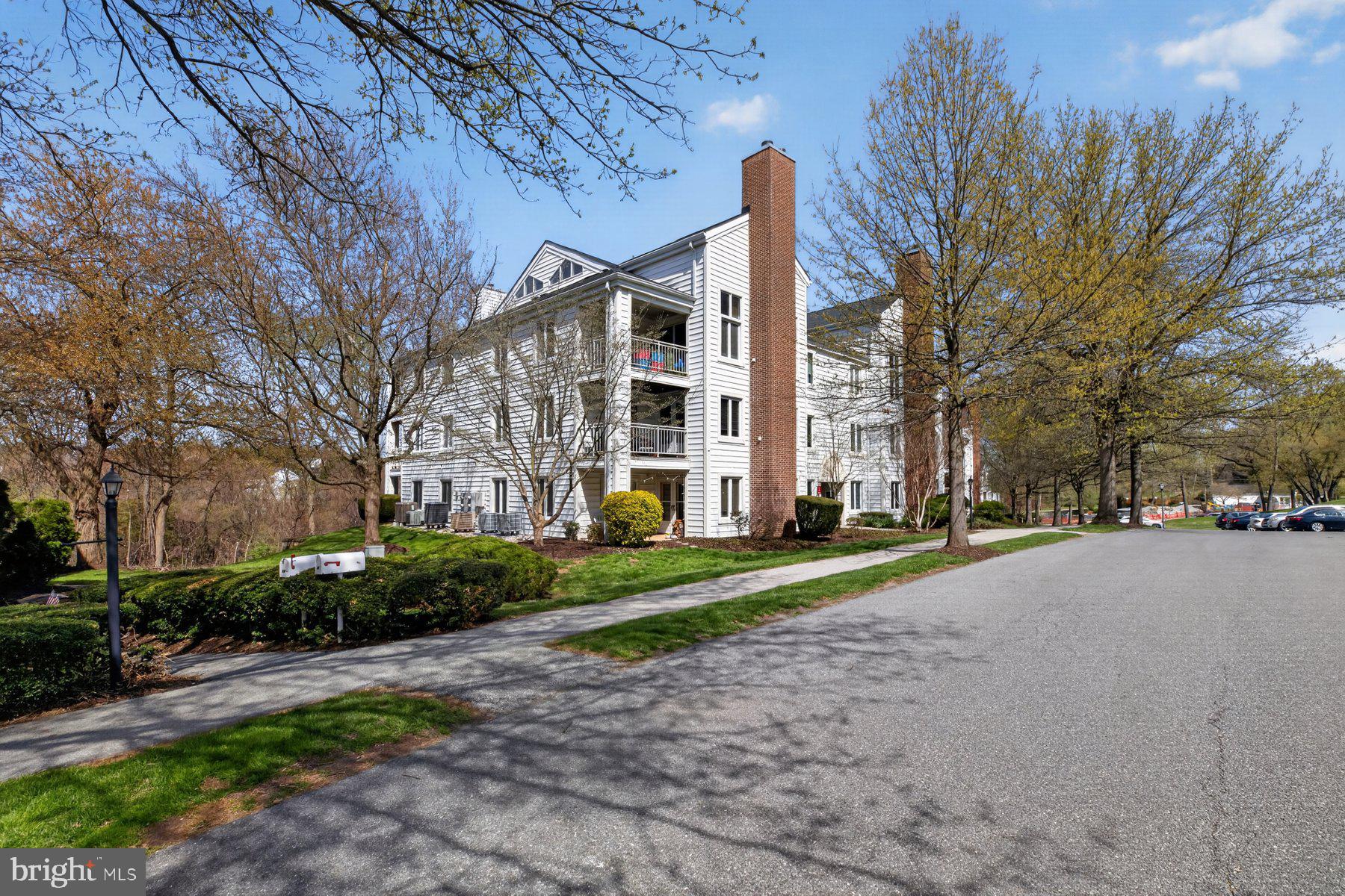 365 Pleasanton Road, Unit A13 Westminster, MD 21157 - Photo 25 of 25 a view of a building with a yard