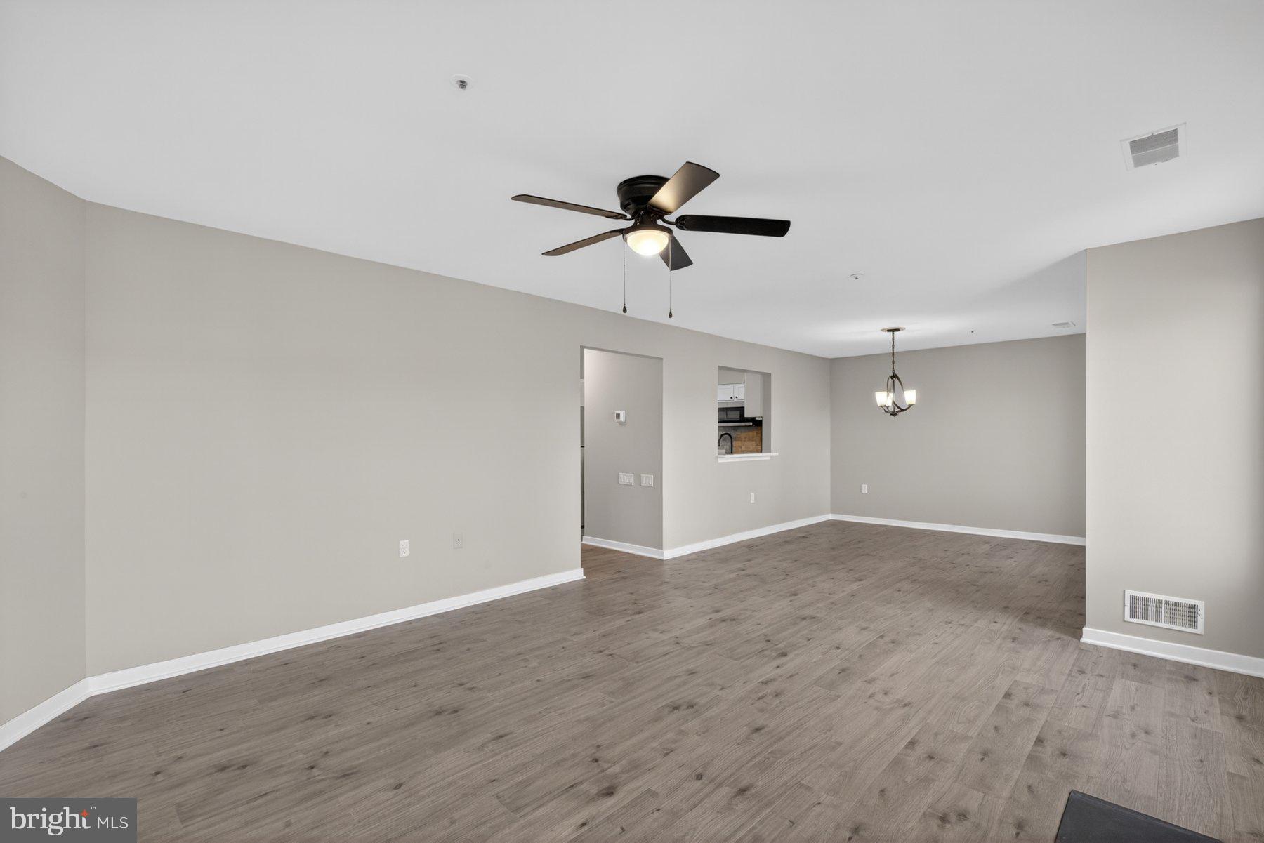 365 Pleasanton Road, Unit A13 Westminster, MD 21157 - Photo 3 of 25 a view of a room with an empty space and a ceiling fan