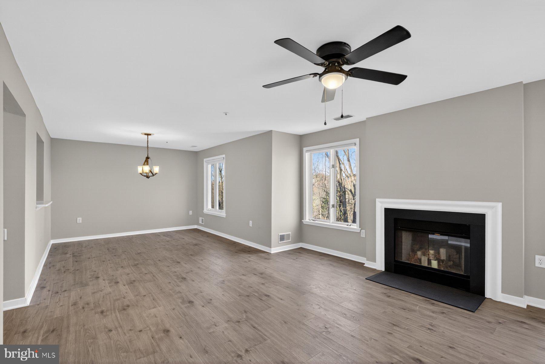 365 Pleasanton Road, Unit A13 Westminster, MD 21157 - Photo 4 of 25 a view of an empty room with window and fireplace