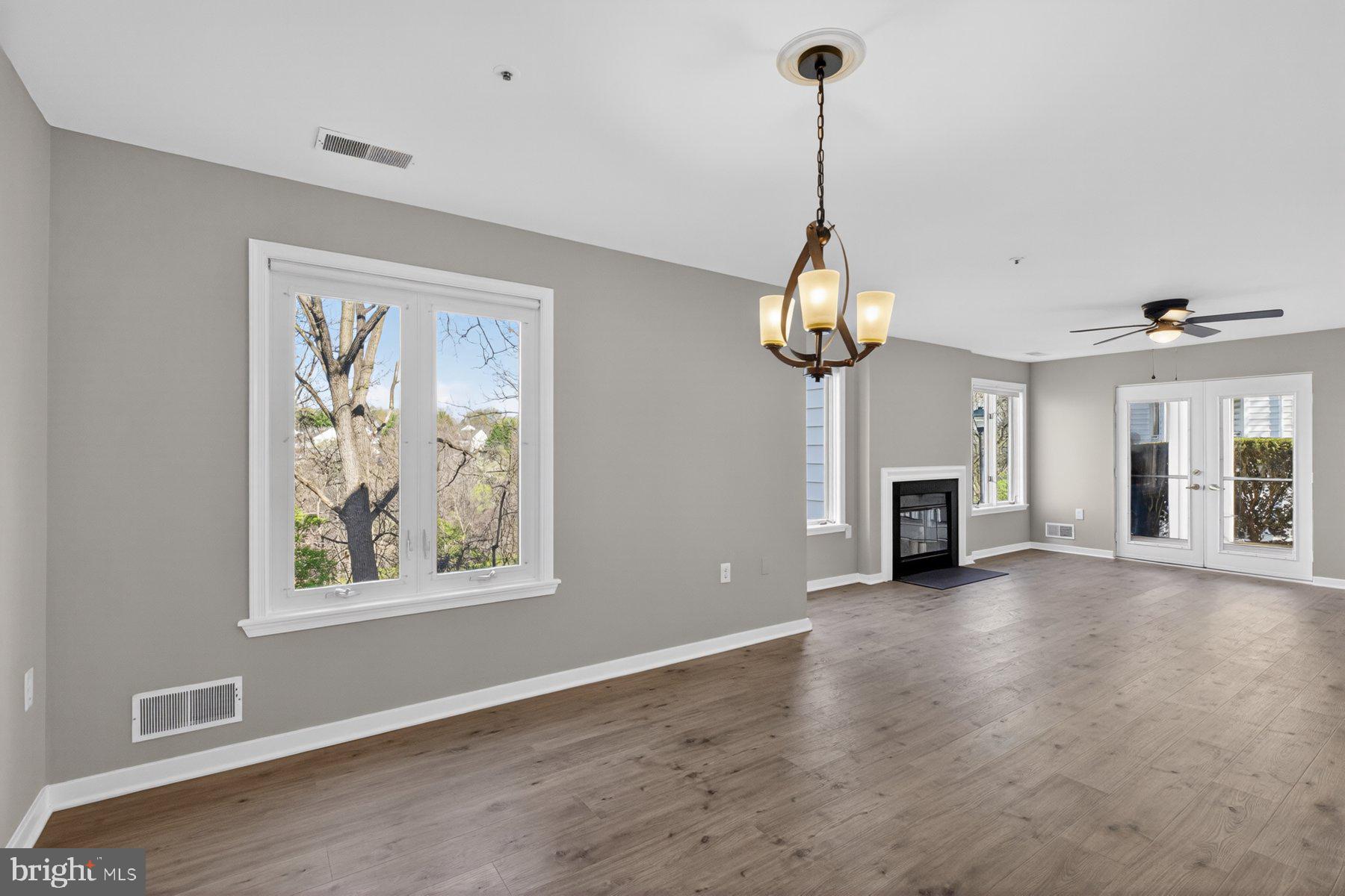365 Pleasanton Road, Unit A13 Westminster, MD 21157 - Photo 7 of 25 a view of an empty room with a window and a chandelier