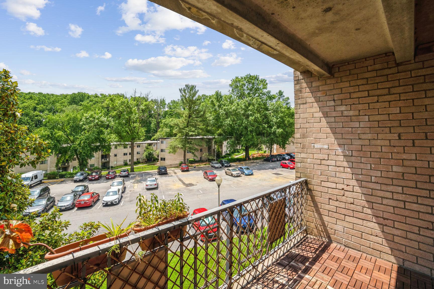 12200 Braxfield Court, Unit 209 Rockville, MD 20852 - Photo 14 of 17 a view of a balcony with chairs