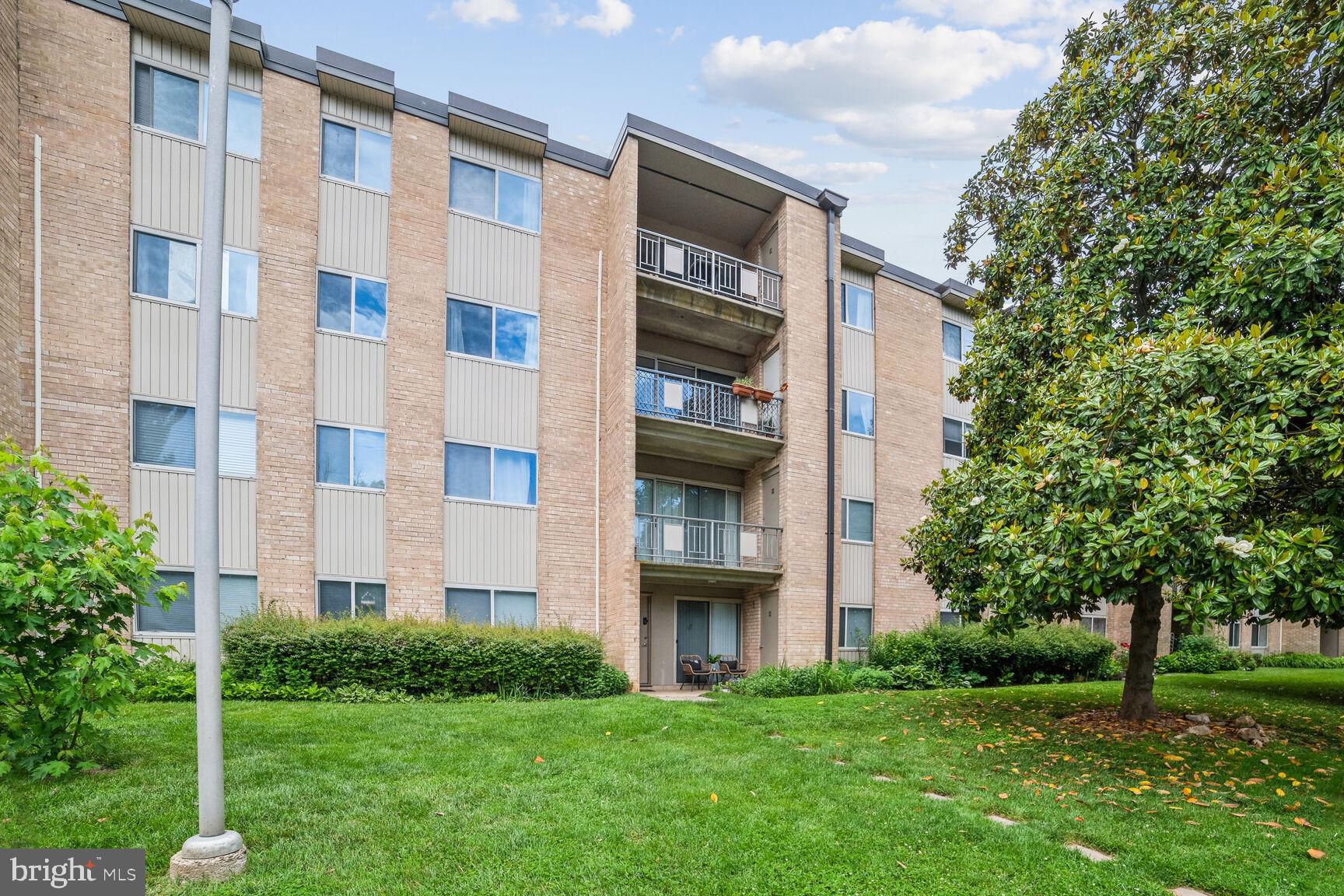 12200 Braxfield Court, Unit 209 Rockville, MD 20852 - Photo 15 of 17 a view of building with yard
